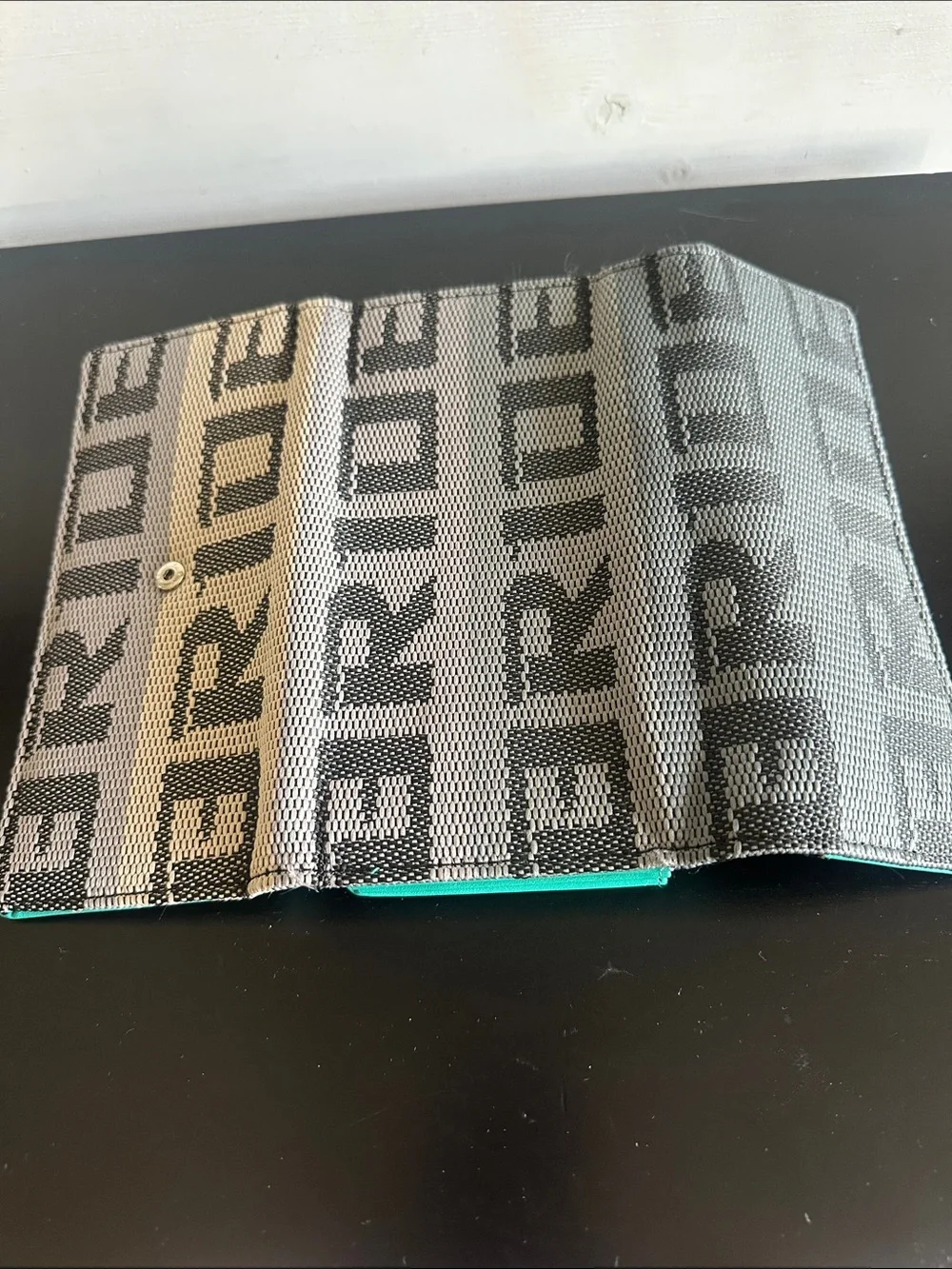 Textured Logo Clutch in Gray and Cream